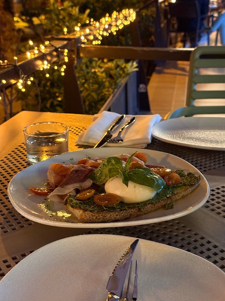 Gastronomy on a terrace with string lights
