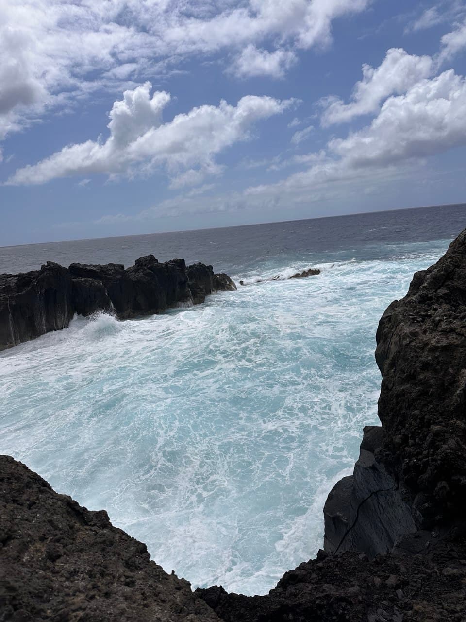 Volcanic rock coastline with turquoise Atlantic water